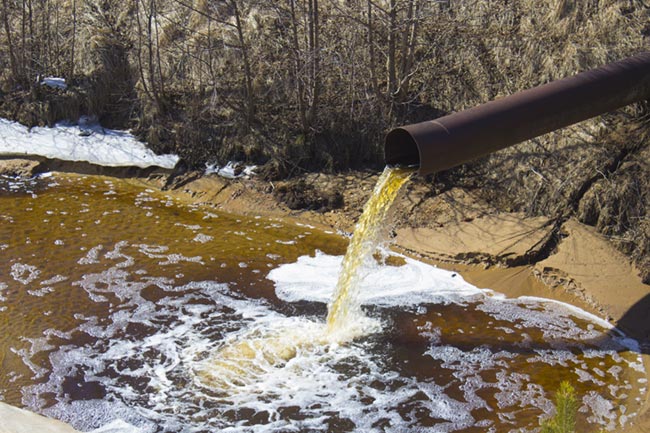 Industrial Wastewater is Discharged from the Pipe