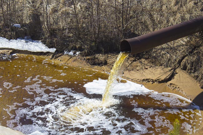 Industrial Wastewater is Discharged from the Pipe
