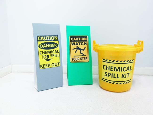 Chemical spill kit bucket and warning signs